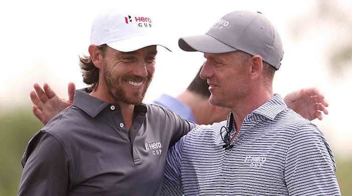 Tommy Fleetwood, Captain of Great Britain & Ireland and Luke Donald, European Ryder Cup Captain react on Day Three of the Hero Cup at Abu Dhabi Golf Club on January 15, 2023 in Abu Dhabi, United Arab Emirates.